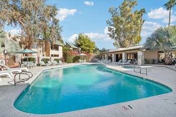 A large swimming pool with a red no swimming sign on the ground. at The Viridian Apartments, Scottsdale